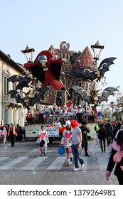 VIAREGGIO, ITALY - MARCH 4, 2012: Festive procession during the renowned Viareggio carnival parade. Spectacular floats depicting caricatures of popular politicians, celebrities or current events.