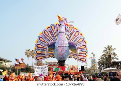 VIAREGGIO, ITALY - MARCH 4, 2012: Festive procession during the renowned Viareggio carnival parade. Spectacular floats depicting caricatures of popular politicians, celebrities or current events.