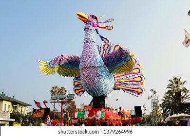 VIAREGGIO, ITALY - MARCH 4, 2012: Festive procession during the renowned Viareggio carnival parade. Spectacular floats depicting caricatures of popular politicians, celebrities or current events.