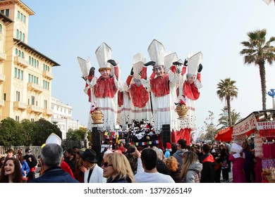 VIAREGGIO, ITALY - MARCH 4, 2012: Festive procession during the renowned Viareggio carnival parade. Spectacular floats depicting caricatures of popular politicians, celebrities or current events.