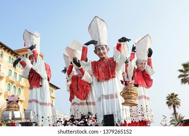 VIAREGGIO, ITALY - MARCH 4, 2012: Festive procession during the renowned Viareggio carnival parade. Spectacular floats depicting caricatures of popular politicians, celebrities or current events.