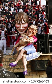 VIAREGGIO, ITALY - MARCH 4, 2012: Festive procession during the renowned Viareggio carnival parade. Spectacular floats depicting caricatures of popular politicians, celebrities or current events.