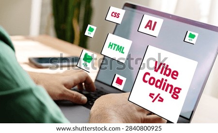 Vibe coding activities with computer focusing on CSS, AI, and HTML in a workspace setting