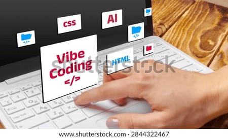 Vibe coding and programming on a laptop with various coding elements visible