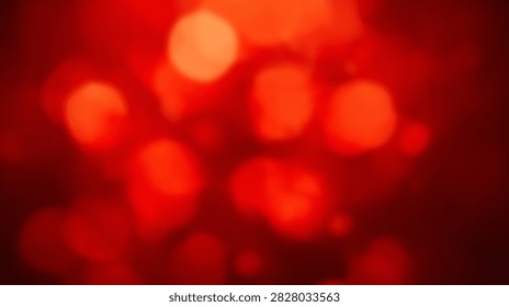 A vibrant abstract background featuring soft red bokeh lights with a warm glow and gentle focus, perfect for festive or energetic designs.