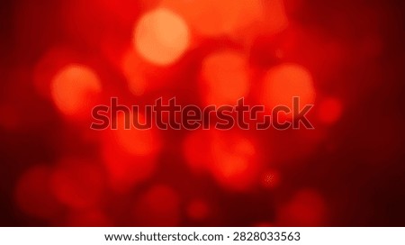 A vibrant abstract background featuring soft red bokeh lights with a warm glow and gentle focus, perfect for festive or energetic designs.