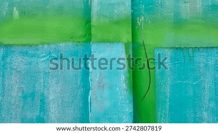 A vibrant abstract composition featuring bold blocks of green and teal paint on a textured surface, with visible brushstrokes and distressed areas, creating a dynamic background.