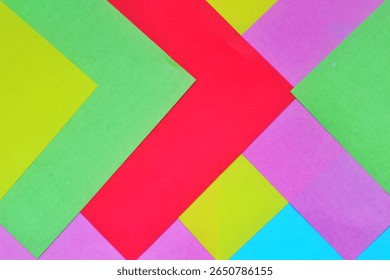 Vibrant abstract layout featuring dynamic curves of multicolored paper in bold hues. A modern and eye-catching background for branding or creative projects.