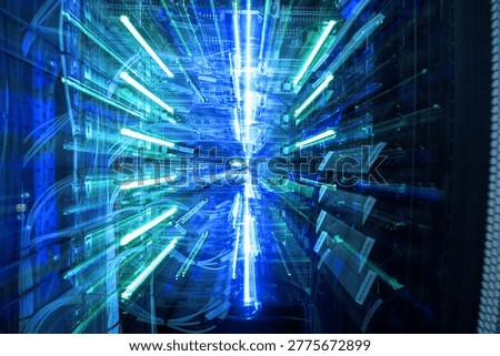 A vibrant abstract representation of technology in a data center, featuring radiant blue lights that convey motion and high-speed data transfer in a modern digital landscape.
