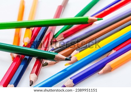 A Vibrant Array of Colored Pencils, Ready for Creative Adventures. A group of colored pencils sitting next to each other