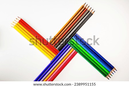 A Vibrant Array of Colored Pencils, Ready to Create Masterpieces. A group of colored pencils sitting next to each other