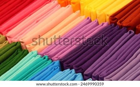 vibrant array of cotton fabric scraps and remnants in a traditional tailor shop for creating garments