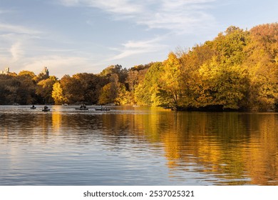 Vibrant beauty of Central Park in October, showcasing the radiant hues of fall foliage. serene landscape of golden, amber, and crimson leaves, highlighting the stunning seasonal transformation. - Powered by Shutterstock