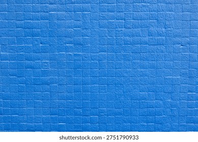 A vibrant blue surface featuring a repeating grid of small squares. A versatile industrial or modern backdrop for bold graphic designs.