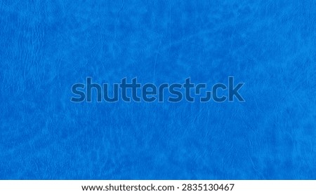 Vibrant blue texture with an irregular surface, subtle creases and tactile finish, ideal for abstract backgrounds, graphic design and creative compositions.