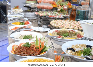 A vibrant buffet display featuring an array of colorful dishes, fresh salads, and beautifully garnished appetizers, inviting guests to enjoy a delightful culinary experience.