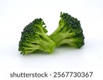 A vibrant bunch of fresh broccoli, ready to be cooked, Close-up of steamed broccoli florets, tender and full of flavor, A farmer harvests a bountiful crop of organic broccoli.