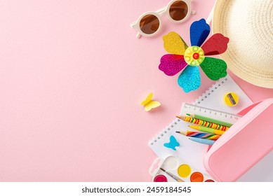 Vibrant children's summer educational tools including a colorful pinwheel, school supplies, and a straw hat spread over a pink background, symbolizing fun learning - Powered by Shutterstock