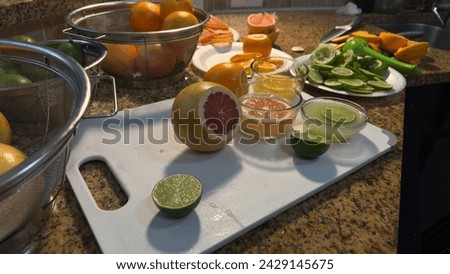 Vibrant Citrus Array: Oranges, Grapefruits, and Lemons in Sleek Arrangement with Fresh Juices