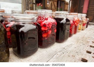 Vibrant clored and testefuly looking compote and jam jars on the table