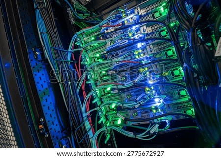 A vibrant close-up image of a server rack showcasing colorful LED lights and intricate wiring, representing modern technology and data management.