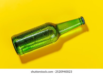 Vibrant cold beer bottle against a bright yellow background. Visible condensation, stand out sharply, creating a lively and refreshing visual appeal - Powered by Shutterstock