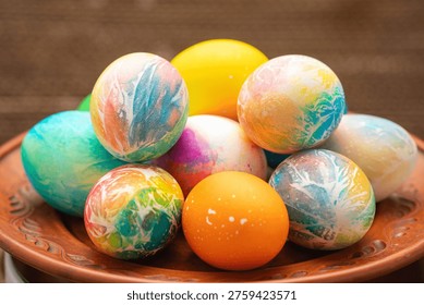 A vibrant collection of painted Easter eggs on a plate.