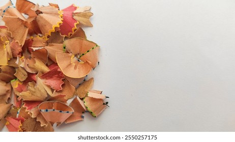 A vibrant collection of pencil shavings arranged on a clean white background, showcasing creativity and artistic expression. - Powered by Shutterstock