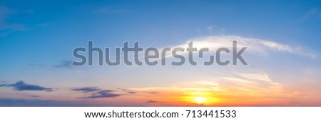 Vibrant color panoramic sun rise and sun set sky with cloud on a cloudy day. Beautiful cirrus cloud. Panorama high resolution photograph.