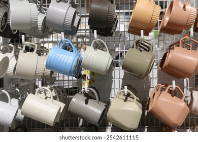 A Vibrant and Colorful Display of Modern Mugs Hanging Elegantly for All to See and Enjoy - Powered by Shutterstock