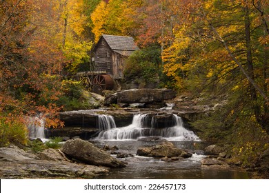 The vibrant colors of Autumn surround the old grist mill at Babcock State Park in West Virginia.