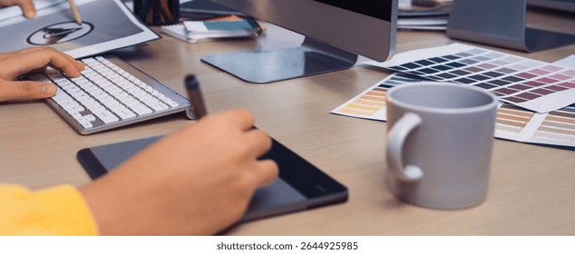 A vibrant creative workspace featuring a computer, graphics tablet, and various design tools. The image captures the essence of artistic collaboration and innovation. SACTR