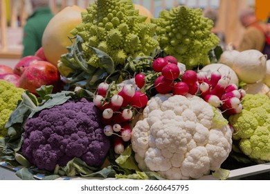 Vibrant display of assorted vegetables featuring cauliflower, radishes, and romanesco, showcasing freshness and variety.
