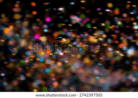 A vibrant and dynamic abstract background featuring a multitude of colorful bokeh lights, creating a festive and celebratory atmosphere.