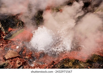 Vibrant geothermal spring with steam and colorful mineral deposits, showcasing nature's energy. Location: Deildartunguhver, the Largest Hot Springs in Europe. - Powered by Shutterstock