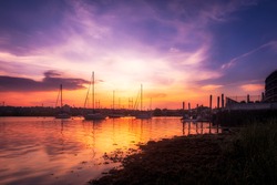 Vibrant Harbor Sunset With Boats