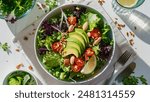 A vibrant and healthy salad featuring fresh greens, cherry tomatoes, sliced avocado, and crunchy almonds, topped with a squeeze of lemon. Perfect for a nutritious and delicious meal