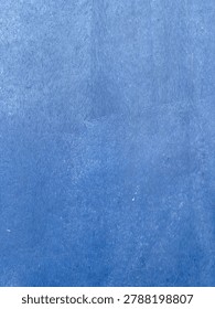 Vibrant indigo facade displaying a gentle gradient and intriguing material subtleties