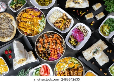 Vibrant Mediterranean feast featuring an array of dishes including wraps, salads, grilled meats, and fresh vegetables. This colorful spread showcases the rich flavors and diverse ingredients. - Powered by Shutterstock