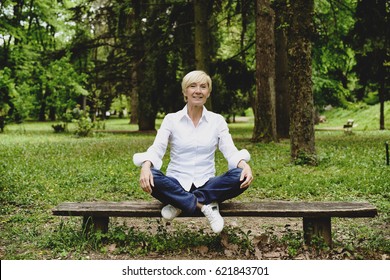 Vibrant Mid Age Woman Laughing In Park 