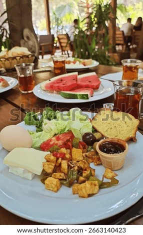 Vibrant Middle Eastern brunch tableau with tea, symbolizing cultural unity and the convivial spirit of Eid al Fitr