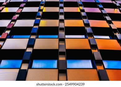 Vibrant Modern Facade with Geometric Patterns and Reflective Windows