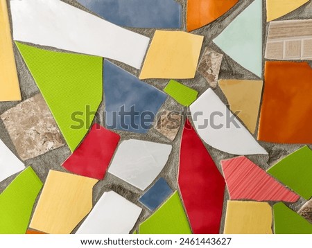 Vibrant Mosaic Artwork Displaying Assemblage of Colored Tiles. Array of brightly colored and textured tiles arranged in captivating mosaic pattern. Full frame. Close-up. Copy space. Selective focus.