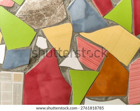 Vibrant Mosaic Artwork Displaying Assemblage of Colored Tiles. Array of brightly colored and textured tiles arranged in captivating mosaic pattern. Full frame. Close-up. Copy space