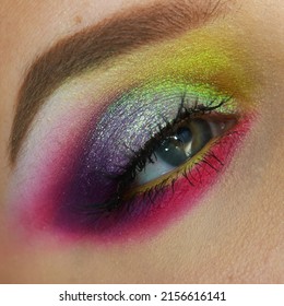 Vibrant Neon Colorful Green, Violet, Pink, Yellow And Purple Summer Festival Shimmery Eye Makeup. Intense And Fun Smoky Eye