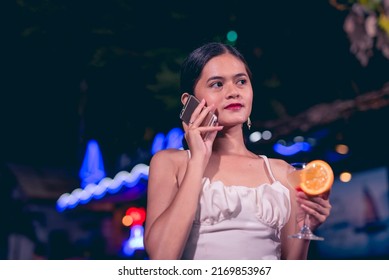  Vibrant nightlife outdoor scene at a bar or cafe with neon lights. - Powered by Shutterstock