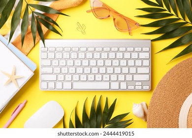 Vibrant online working setup. Top view shot of white keyboard in the middle, mouse, pink sunglasses, notepads, palm leaves and straw hat on yellow background - Powered by Shutterstock