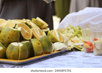 Vibrant, organic orange slices on a colourful tray, perfect for a healthy school snack. Perfect for school lunches, classroom celebrations, or healthy after-school snacks. - Powered by Shutterstock