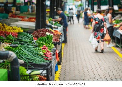 Vibrant outdoor farmers market brimming with fresh, organic vegetables and fruits - Powered by Shutterstock