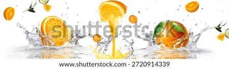 Vibrant panoramic layout of orange fruit slices colliding with bursts of orange juice and clear water. The scene captures the energy of fresh citrus liquid and green leaves in motion on a white surface.